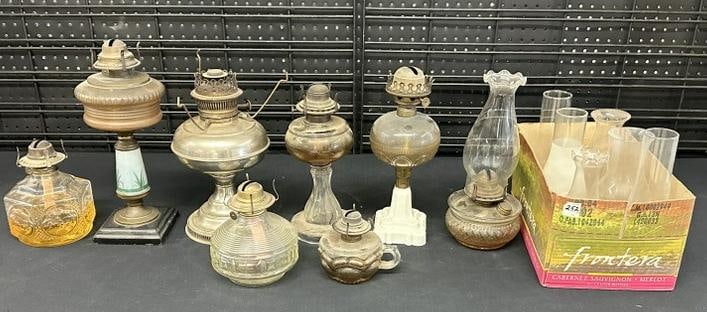 Estate lot older oil lamps and chimneys, good lot for a dealer to sort out…...just as we found: Estate lot older oil lamps and chimneys, good lot for a dealer to sort out…...just as we found them.