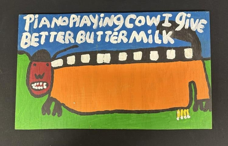 Ruby C. Williams (1949 - 2022) Outsider Art oil on wood board titled ( PIANO PLAYING COW ), Board: Ruby C. Williams (1949 - 2022) Outsider Art oil on wood board titled ( PIANO PLAYING COW ), Board measures 14" x 24". From Hudson Valley estate…...