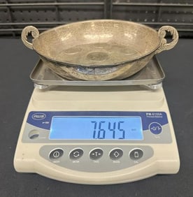 Silver bowl with 19th c foreign silver coins, from local estate, measures 9.5" handle to handle,