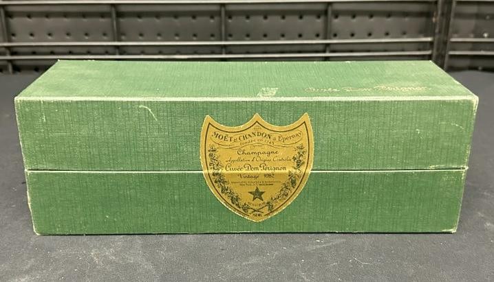Dom Perignon 1982 champagne in sealed box, from fine estate in Woodstock, N.Y. ( 750 ML ), Just as: Dom Perignon 1982 champagne in sealed box, from fine estate in Woodstock, N.Y. ( 750 ML ), Just as we found it stored away….box in nice condition also…..