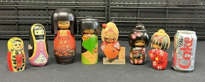 (7) wooden souvenir dolls, (5) are Asian, and other (2) Russian ? One of the Russian ones has more (1 of 5)