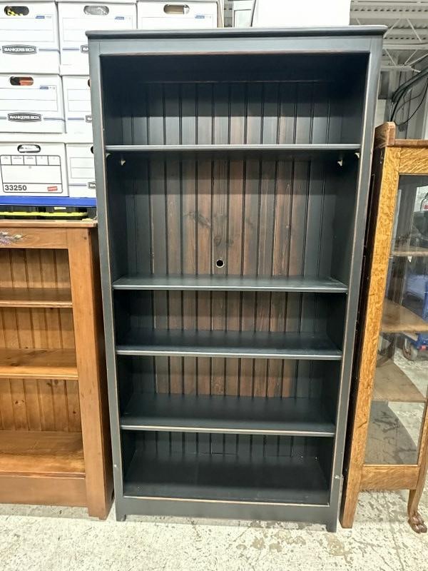 Contemporary black pine bookcase with adjustable shelves, had a round hole drilled in back most (1 of 1)