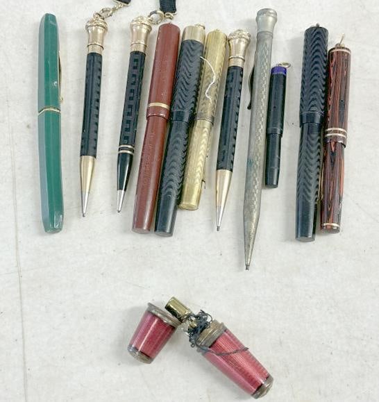 Fountain pens, pencils and enamel small pen like case with sewing needle and thread in it….just as (1 of 3)