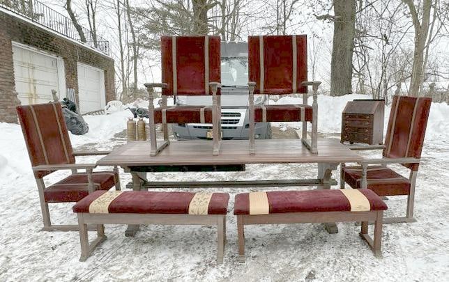 Nice oak circa 1910 dining room set to include long trestle table with cubby holes underneath on: Nice oak circa 1910 dining room set to include long trestle table with cubby holes underneath on both sides at one end, (4) armchairs with (2) taller backs for the ends, and (2) benches, from estate i