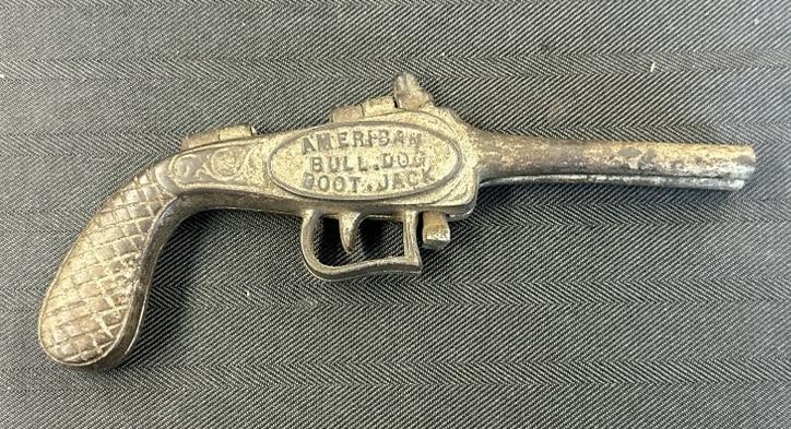 AMERICAN BULL DOG BOOT JACK cast iron pistol, just as we found it in a local estate. Measures 8.25": AMERICAN BULL DOG BOOT JACK cast iron pistol, just as we found it in a local estate. Measures 8.25" long.