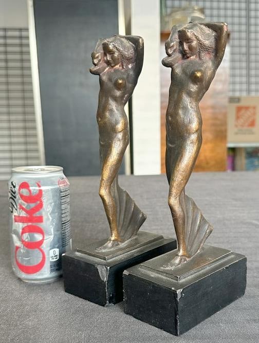 (2) Art Nouveau bronze coated sculptures of Woman with Panther on shoulder, on black wood bases,: (2) Art Nouveau bronze coated sculptures of Woman with Panther on shoulder, on black wood bases, with one base having a chip off front, they measure 10.25" high. From local estate, nice patina. ( Arti