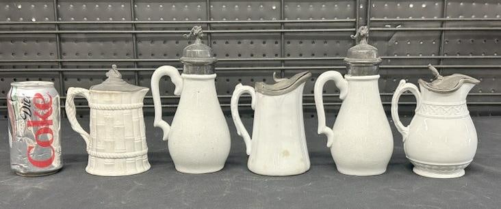 (5) pewter lid ironstone & other pitchers, from Woodstock, N.Y. estate of oldtime antique dealer, to: (5) pewter lid ironstone & other pitchers, from Woodstock, N.Y. estate of oldtime antique dealer, to show scale the tallest measures 8" high. Good overall condition.