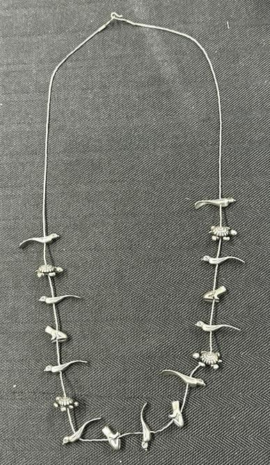 Vintage STERLING SILVER Heishi 17 charm fetish necklace, birds, frogs, etc.....measures 30" long and: Vintage STERLING SILVER Heishi 17 charm fetish necklace, birds, frogs, etc.....measures 30" long and weighs 1.81 troy ounces.