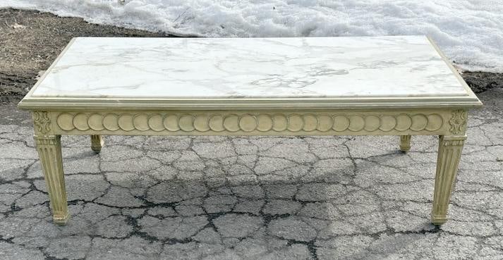 Decorative Neoclassical marble top coffee table, nice form and carved design, from upscale estate in: Decorative Neoclassical marble top coffee table, nice form and carved design, from upscale estate in Westchester, New York. In very nice structurally sound condition. Measures 47" wide x 23" deep x 16
