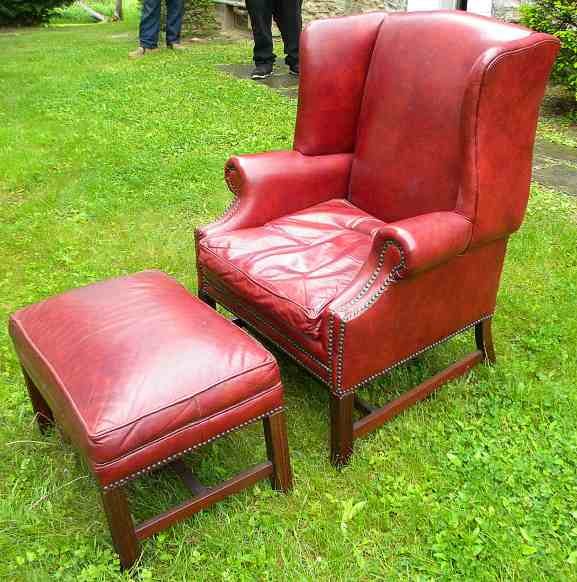 Red Leather Wing Chair & Ottoman in Wonderful Condition: Red Leather Wing Chair & Ottoman in Wonderful Condition, from same estate as Chesterfield sofa, made by Carolina Leather Company. Chair measures 41" high x 31" across and 28" deep....Really nice.....