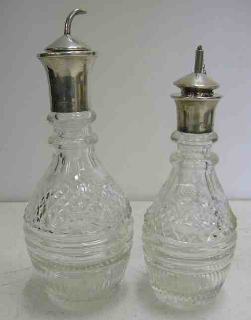 Sterling Top Old Crystal Bitters & Liqueur Bottles: Sterling Top Old Crystal Bitters & Liqueur Bottles, from local older estate. Both have hallmarked silver tops, both in good condition, one measures 8 1/2", the other is 7 1/2".....