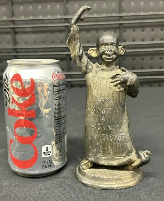 Cast metal ( YELLOW KID ) paperweight, nice overall condition, measures 7" high. (1 of 2)
