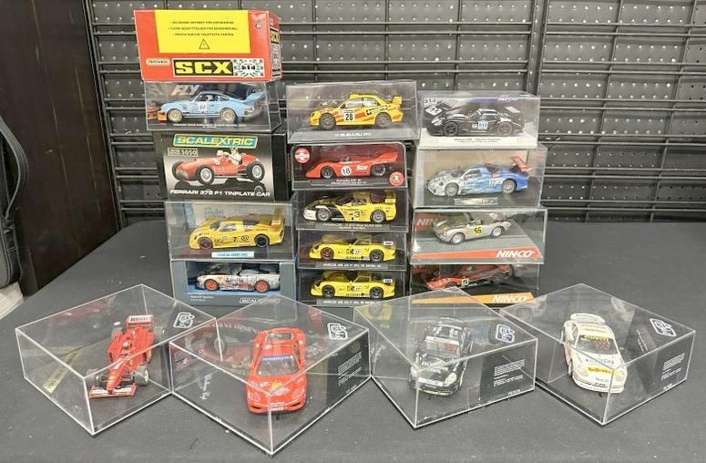 (18) slot cars in original cases from estate collection we are selling. All in fine condition. Part (1 of 6)