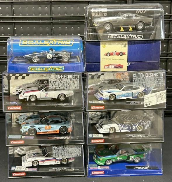 (9) slot cars in original cases, fine condition...Part II of the over 2400 piece New England Slot (1 of 3)