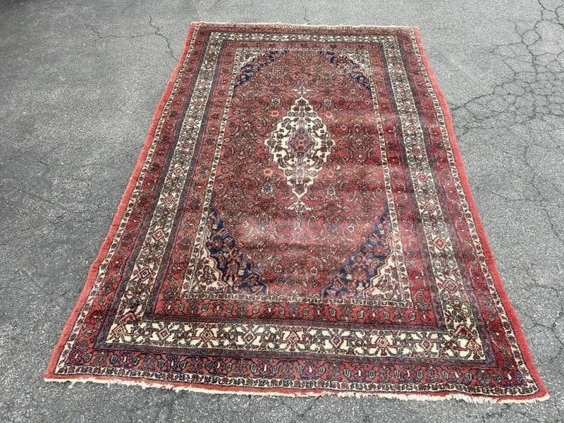 Handmade wool oriental rug, from local estate, nice overall condition, measures 115" x 74.5". (1 of 2)