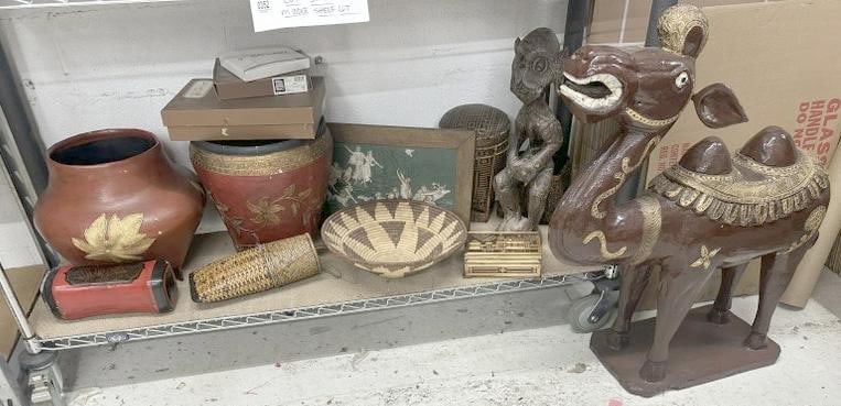 Estate lot of misc. goods to include large carved wood camel ( missing one ear ), baskets, pots, (1 of 6)