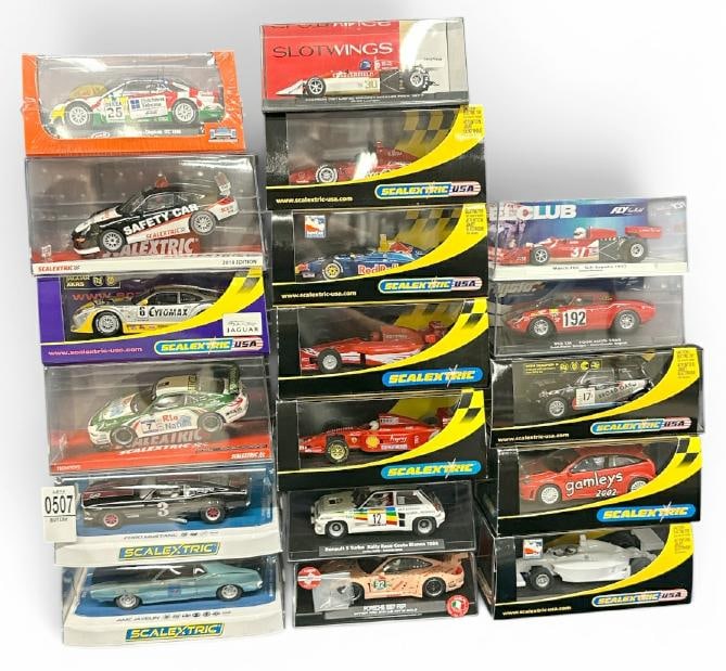 (18) slot cars in original cases, fine overall condition. This is PART III of the New England estate (1 of 3)