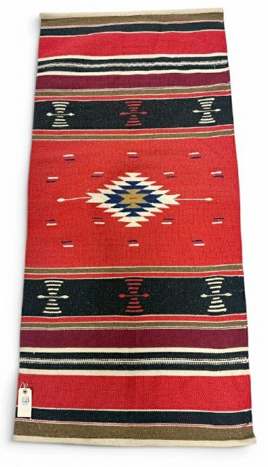 Handmade wool Chimayo rug, from fine home in Hudson Valley, nice overall condition, measures 57" x: Handmade wool Chimayo rug, from fine home in Hudson Valley, nice overall condition, measures 57" x 27".