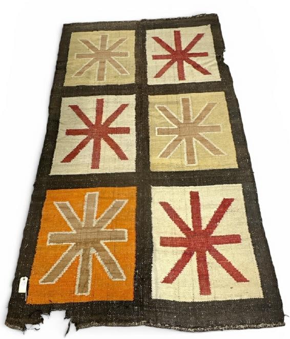 Interesting design wool handmade rug with geometric designs, has some rips and small missing pieces: Interesting design wool handmade rug with geometric designs, has some rips and small missing pieces on edge as pictured, from fine home in Hudson Valley, measures 98.5" x 59".