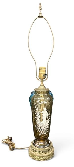 Nice MARY GREGORY amber table lamp, nice blue handles, painted on both sides, in fine estate: Nice MARY GREGORY amber table lamp, nice blue handles, painted on both sides, in fine estate condition. Measures 13" high to top of base, not including the harp.