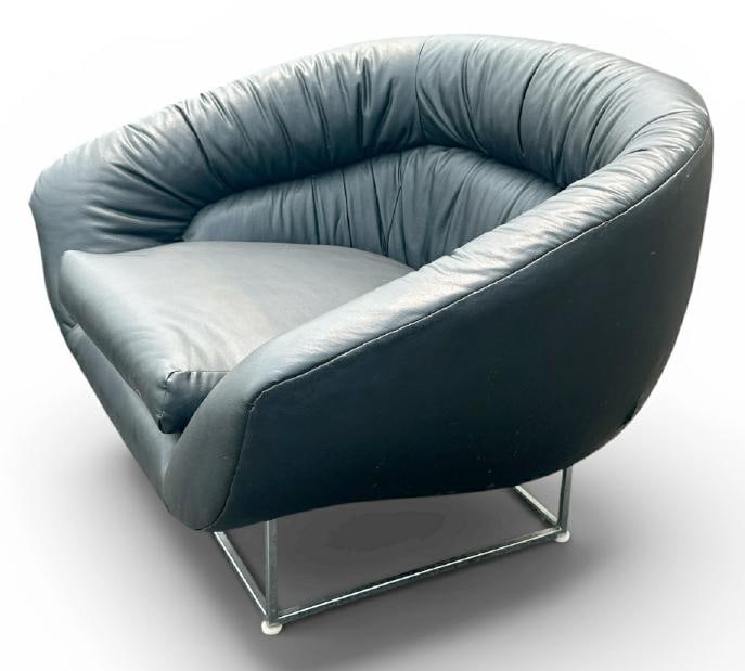 Circa 1970's black rounded chair, plush, vinyl upholstery, structurally sound, chrome legs, from (1 of 2)