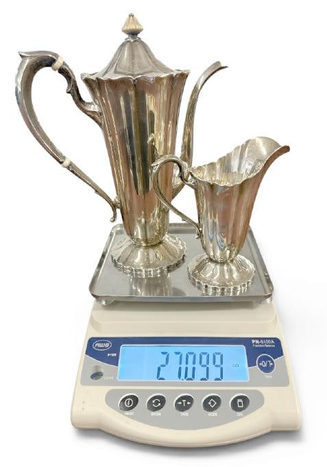 Sterling Silver coffee pot & creamer, not monogrammed, in very nice condition. Coffee pot measures (1 of 2)