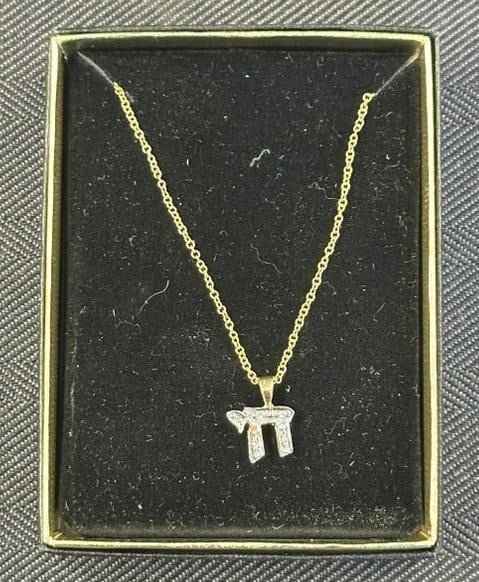 14K Chai pendant with (14K ) chain, chain measures 18" long, chai has diamond chips, weight is 1.87: 14K Chai pendant with (14K ) chain, chain measures 18" long, chai has diamond chips, weight is 1.87 pennyweights.