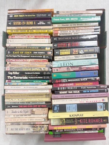 56 paperback books. Includes Flying Saucers Are Real by Donald Keyhoe, East of Eden by John (1 of 6)