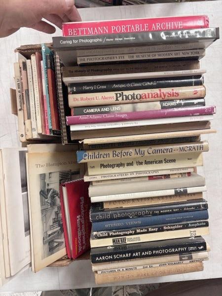 51 books on photographs, photographers, cameras, and art. This lot includes seven photography: 51 books on photographs, photographers, cameras, and art. This lot includes seven photography auction catalogs (six from Sotheby Parke Bernet, one from Parke-Bernett), the Eastman Kodak guide How To M