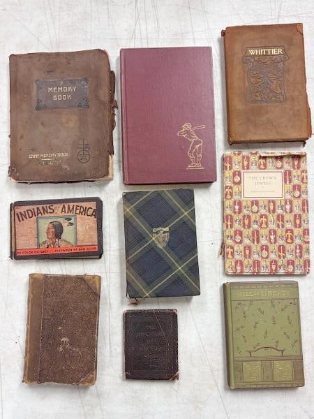 Nine small hardcover or leather bound antiquarian books. This includes a leather-bound Memory Book (1 of 11)