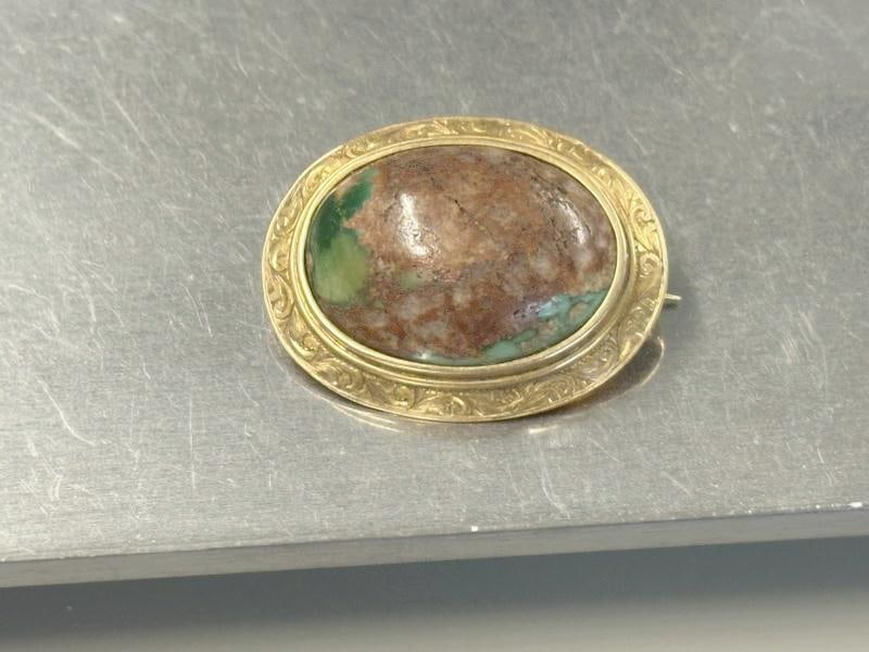 14K oval brooch with turquois stone in center, from local estate, fine condition. Measures 1.5": 14K oval brooch with turquois stone in center, from local estate, fine condition. Measures 1.5" across. Weighs 7.2 pennyweights?...