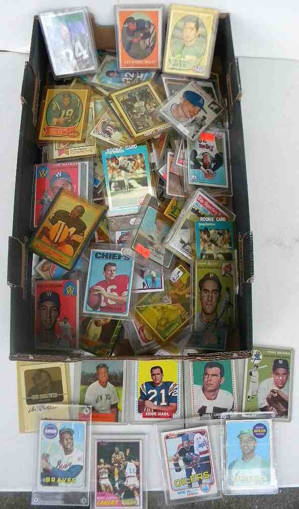 Approx 110 Mixed Baseball, Football Cards 1950-1970's: Approx 110 mixed baseball, football, a few basketball cards, 1950's-1970's, includes 1954 Yogi Berra, 1969 Reggie Jackson rookie card, 1969 Hank Aaron, Nolan Ryan cards, Johnny Unitas, Roger Staubach,