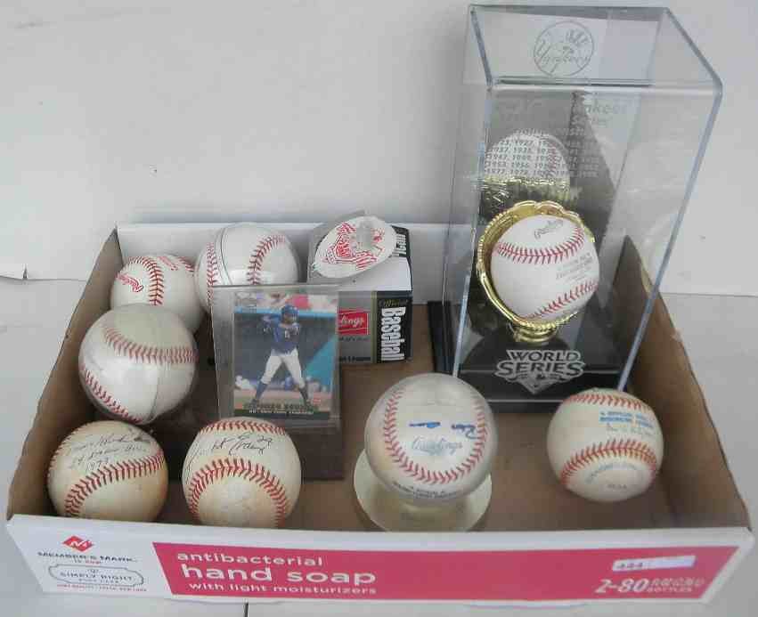 Official & Comm. Baseballs incl Signed Soriano: 9 Official and Commemorative baseballs, including signed Alfonso Soriano on official Eastern League ball in case with 2000 Pacific rookie card #303 in excellent condition, 2009 NY Yankees 27th World S