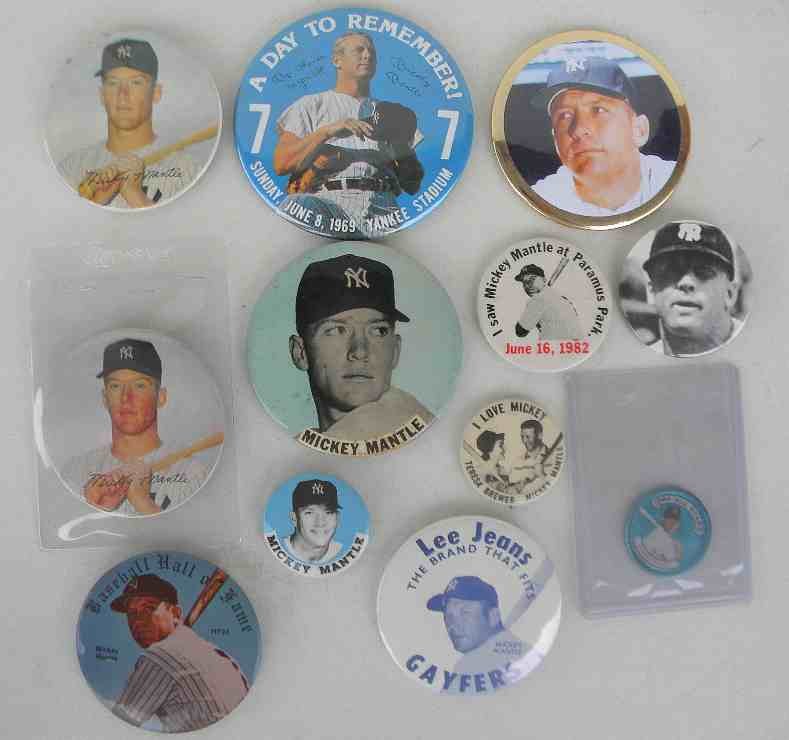 11 Mickey Mantle Pinbacks & 1 Coin: 11 Mickey Mantle pinbacks & 1 coin including stadium pins, I Love Mickey Teresa Brewer pin, 1982 Paramus Park pin, 1969 A Day To Remember At Yankee stadium, Lee Jeans, and others, some with light foxi