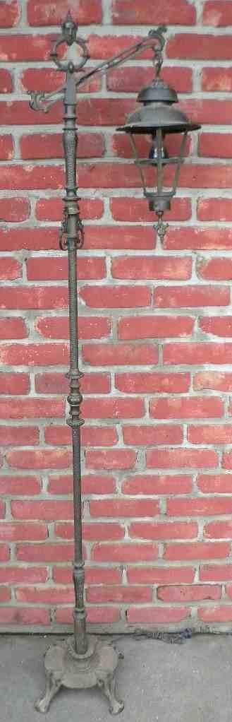 REMBRANDT Arts & Crafts Floor Lamp w/ Devil's Face: REMBRANDT Arts & Crafts Floor Lamp w/ Devil's Face on top, with hanging lantern, great detail on this iron lamp. Measures 67 1/4" high, estate fresh, I see no damage...