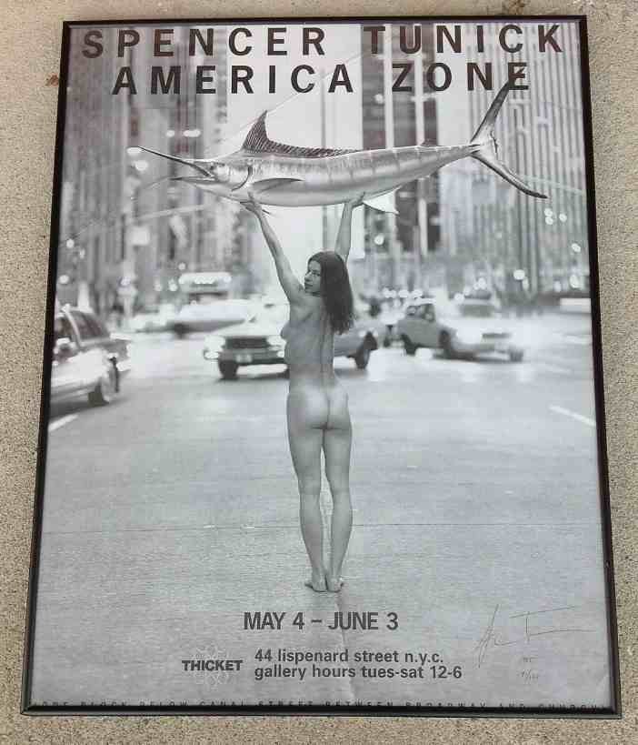 SPENCER TUNICK AMERICA ZONE SIGNED POSTER 91/100: SPENCER TUNICK AMERICA ZONE SIGNED POSTER 91/100, in black metal frame, measures 29 1/2" x 22", has crease on top of poster, probably when laid down on foam core when framed. Signed lower right....