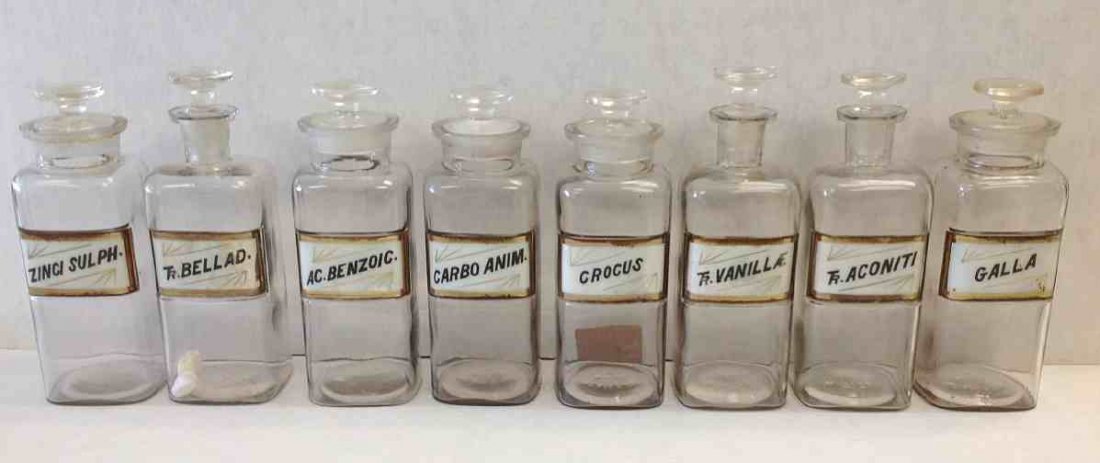 (8) Early Apothecary Bottles with Labels under glass,: (8) Early Apothecary Bottles with Labels under glass, from old Kingston, N.Y. Pharmacy. Measure 10" high with stoppers, overall nice condition.
