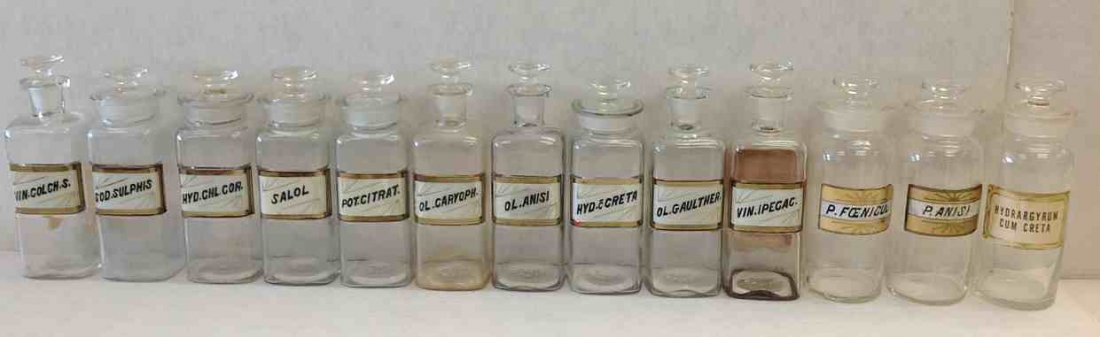 (13) Early Apothecary Jar with labels under glass, with: (13) Early Apothecary Jar with labels under glass, with stoppers, from old Pharmacy in Kingston, N.Y. ( one has paper label, so there are 12 with labels under glass). Average height is 8 1/2" to 9 1/2