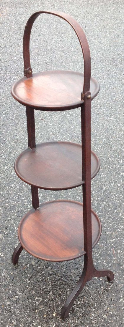 George C. Flint Co. 3 tier stand old brace on one foot: George C. Flint Co. 3 tier stand old brace on one foot measures 28"h