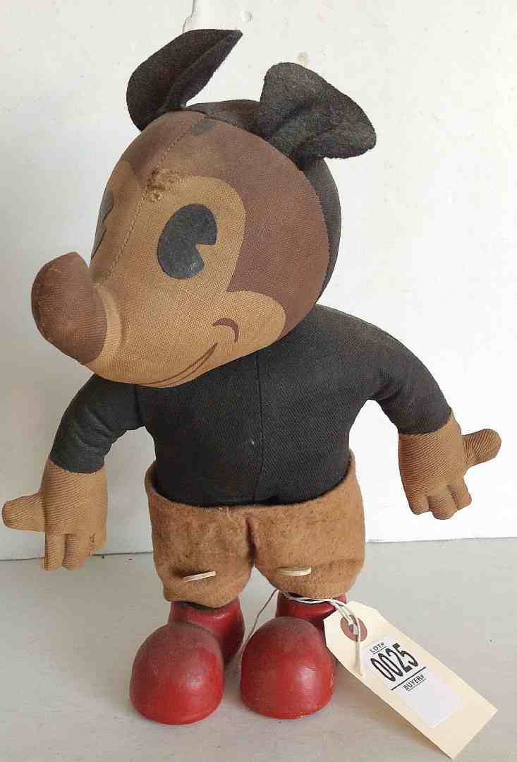 EARLY MICKEY MOUSE PIE EYED CLOTH DOLL WITH COMPOSITION: EARLY MICKEY MOUSE PIE EYED CLOTH DOLL WITH COMPOSITION SHOES, NORMAL WEAR, TEAR IN BLACK CLOTH BEHIND ONE EAR, MEASURES 12" TO TOP OF EARS.