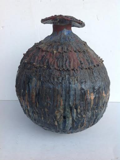 OLDER SOUTHERN(?) STONEWARE MONUMENTAL VESSAL, DRIP: OLDER SOUTHERN(?) STONEWARE MONUMENTAL VESSAL, DRIP GLAZE, MULTI COLORED. MEASURES 16" HIGH AND 13" across at the widest point. The mushroom lip has older repaired pieces.