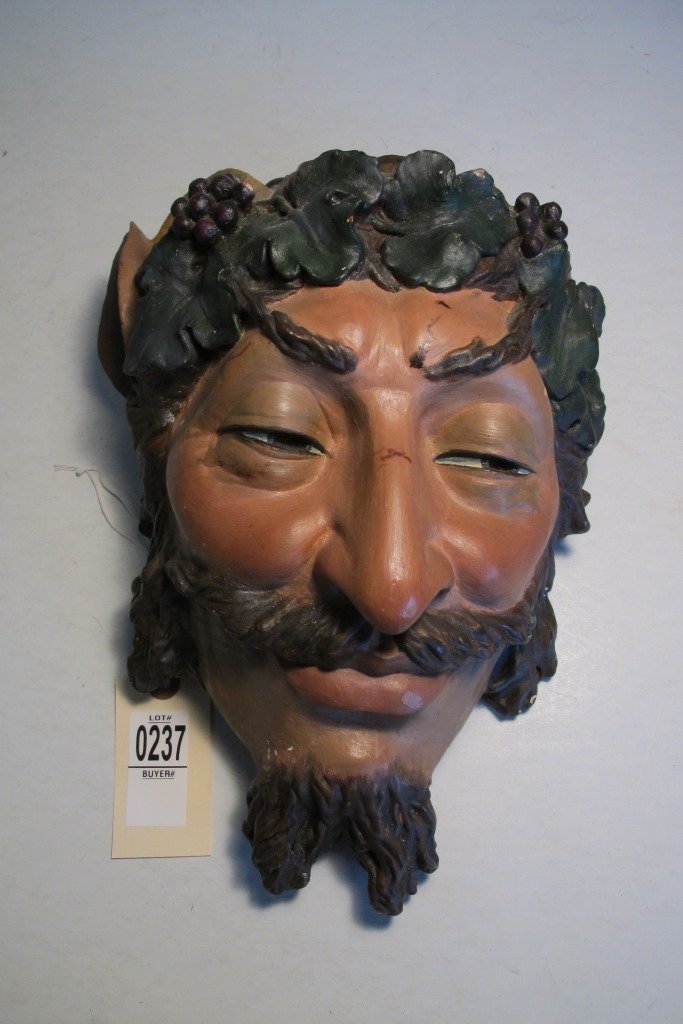 LARGE TERRA COTTA WALL HANGING OF BACHAS(?)(WINE GOD),: LARGE TERRA COTTA WALL HANGING OF BACHAS(?)(WINE GOD), MANUFACTURED BY THE FRANCIS CO, CLEVELAND OHIO, LIGHT DAMAGE ON HORNS AND 1 EAR, MEASURES 13" X 8 1/2", AS PICTURED