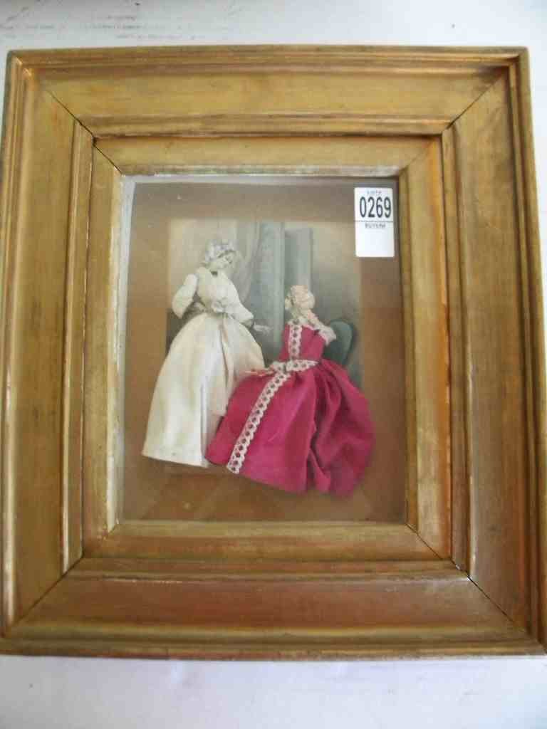 FRAMED SHADOW BOX OF 2 WOMEN, FABRIC DRESSES ON HAND: FRAMED SHADOW BOX OF 2 WOMEN, FABRIC DRESSES ON HAND TINTED BACKGROUND, FROM JAMES CAGNEY ESTATE, MEASURES 9" X 7 1/2", GOOD CONDITION, AS PICTURED