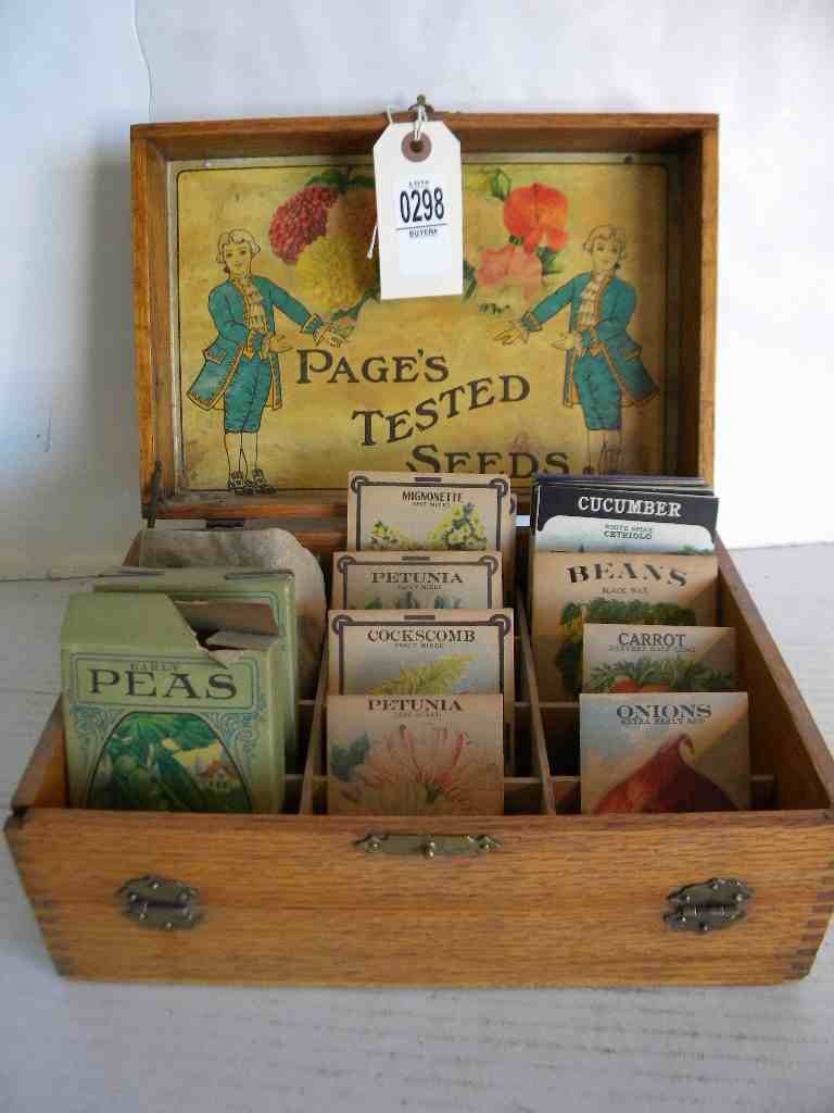 OAK WOODEN PAGE'S TESTED SEEDS DISPLAY CASE WITH EARLY: OAK WOODEN PAGE'S TESTED SEEDS DISPLAY CASE WITH EARLY SEED PACKETS, MEASURES 11" WIDE, 5" TALL, 7 1/2" DEEP, GOOD CONDITION, AS PICTURED
