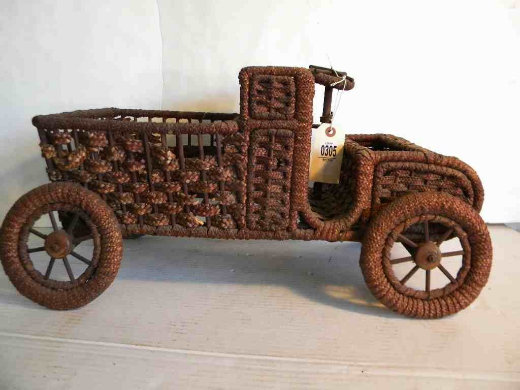 EARLY 1900'S FOLK ART WICKER JALOPY DISPLAY, WITH: EARLY 1900'S FOLK ART WICKER JALOPY DISPLAY, WITH STEERING WHEEL, HEAD LIGHTS & SPOKE WHEELS, HAS WEAR & DAMAGE TO TRUCK BED, MEASURES 24" LONG, 12" TALL,12" WIDE, AS PICTURED