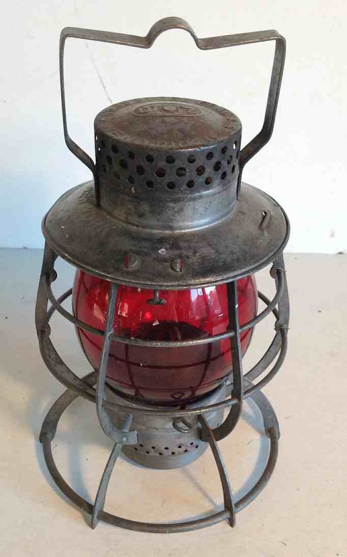 DIETZ CITY OF NEW YORK HAND LANTERN WITH RED GLOBE,: DIETZ CITY OF NEW YORK HAND LANTERN WITH RED GLOBE, MEASURES 11 1/2" HIGH TO TOP OF HANDLE. FROM THE WALTER G. RICH ESTATE COLLECTION.