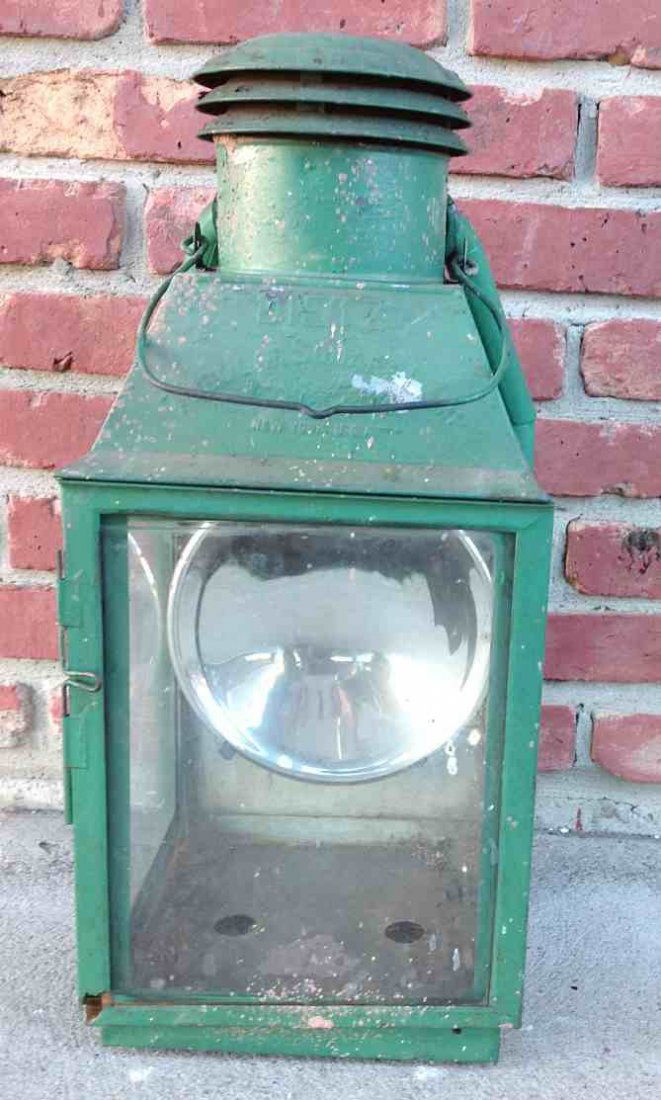 DIETZ INSPECTION KEROSENE LAMP, WITH 9" REFLECTOR.: DIETZ INSPECTION KEROSENE LAMP, WITH 9" REFLECTOR. MEASURES 22 1/2" HIGH, OLD GREEN PAINT. FROM THE WALTER G. RICH ESTATE COLLECTION.