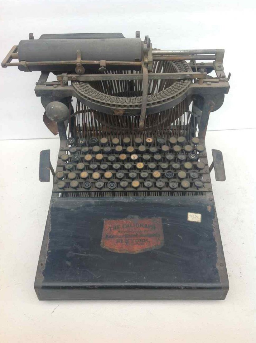THE CALIGRAPH TYPEWRITER MADE BY AMERICAN WRITING: THE CALIGRAPH TYPEWRITER MADE BY AMERICAN WRITING MACHINE CO. HAS SOME WEAR TO BLACK PAINT, MISSING SOME CAPS, SOME LIGHT RUST, AND IN NEED OF CLEANING. FROM ESTATE COLLECTION OF WALTER G. RICH.