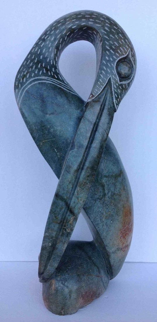R. MUK CARVED STONE FIGURAL BIRD, INUIT (?), MEASURES: R. MUK CARVED STONE FIGURAL BIRD, INUIT (?), MEASURES 19 1/2" HIGH.