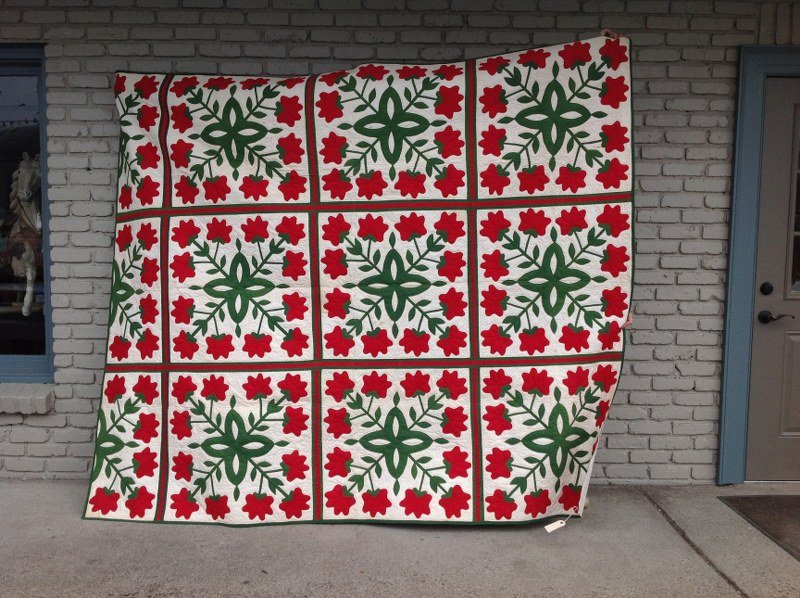 ESTATE APPLIQUE QUILT WITH RED FLOWERS FROM UPSTATE NEW: ESTATE APPLIQUE QUILT WITH RED FLOWERS FROM UPSTATE NEW YORK ESTATE, SOME LIGHT STAINING ON FRONT AND BACK, WONDERFUL PATTERN, MEASURES 82" X 97", AS PICTURED